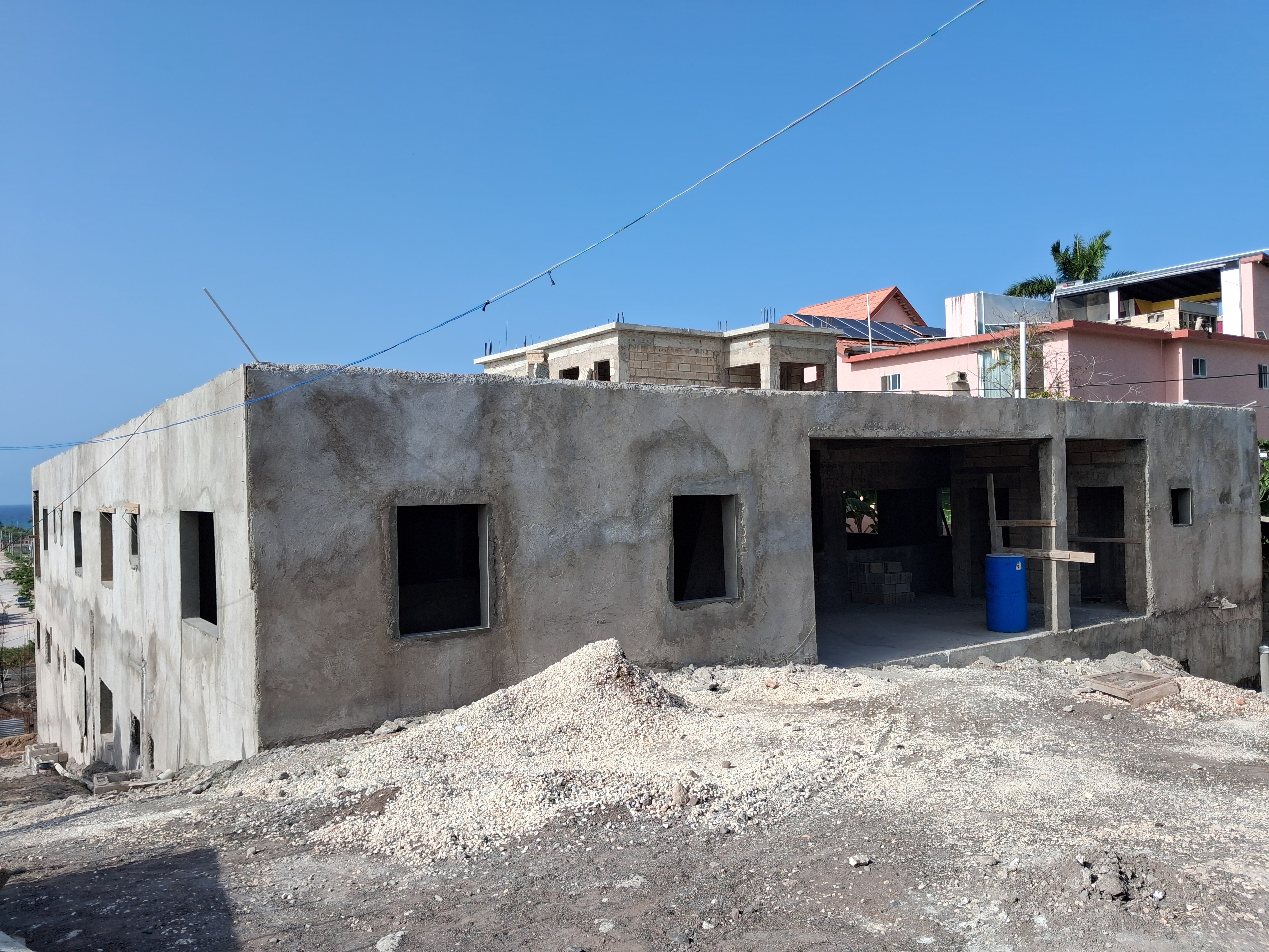 Client construction site — exterior wall with window openings